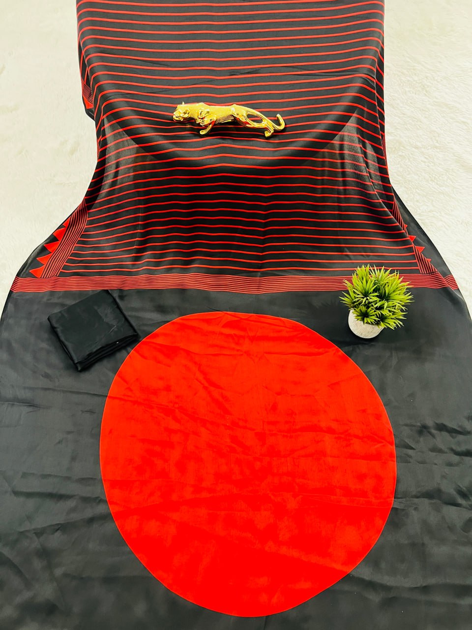 Black & Maroon Saree with Bold Red Circle Pallu – Modern Designer Look