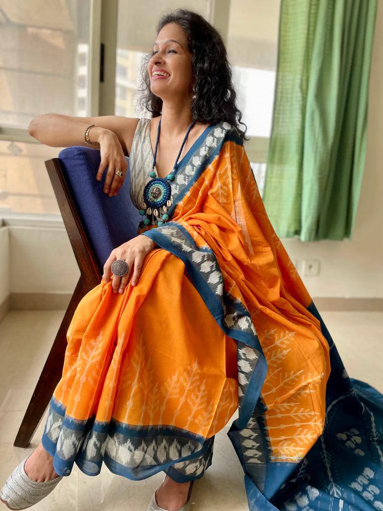 Bright Orange Linen Cotton Saree with Blue Tribal Ikat Border